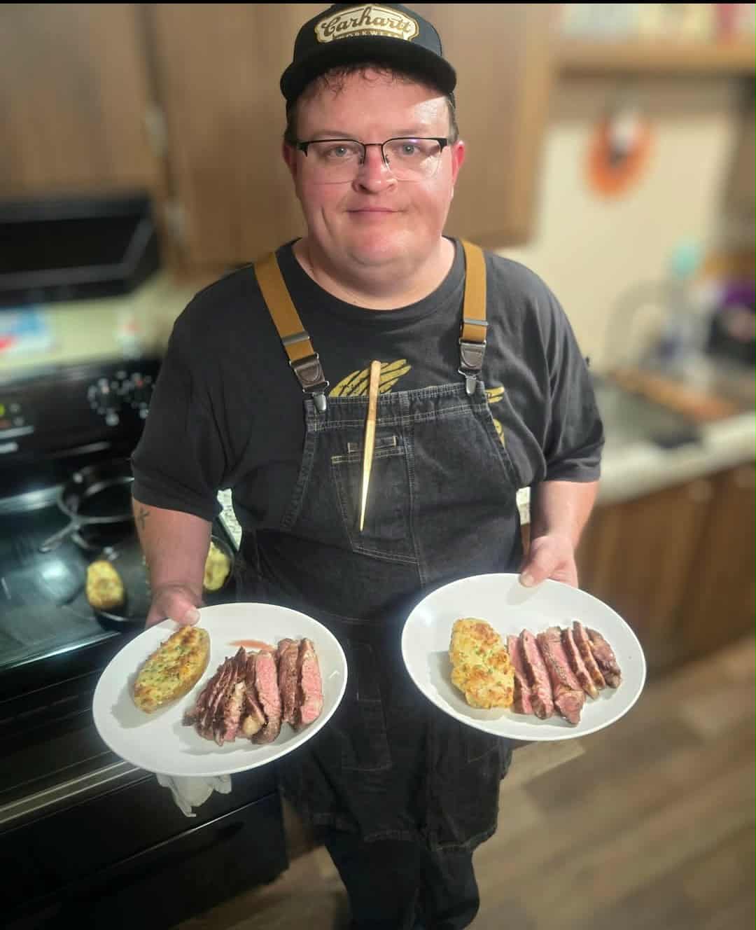 Chef with steak plates
